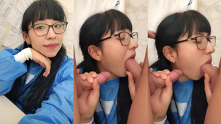 Slut With Glasses Sucks Two Cocks