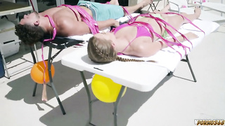 Two chicks and one guy have group sex and role-playing at a resort