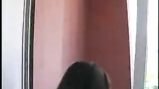 A double blowjob on a hotel balcony