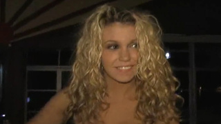 Bartender Alisha King serves two customers