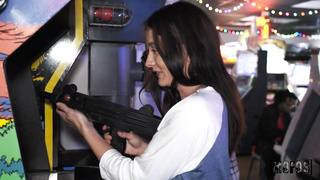 Veronica Church playing fliperama