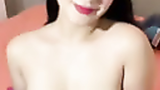 young girl massaging her breasts