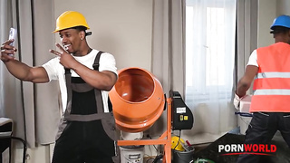 Construction workers Darrell Deeps and Jesus Reyes are in the middle of a job when project manager,